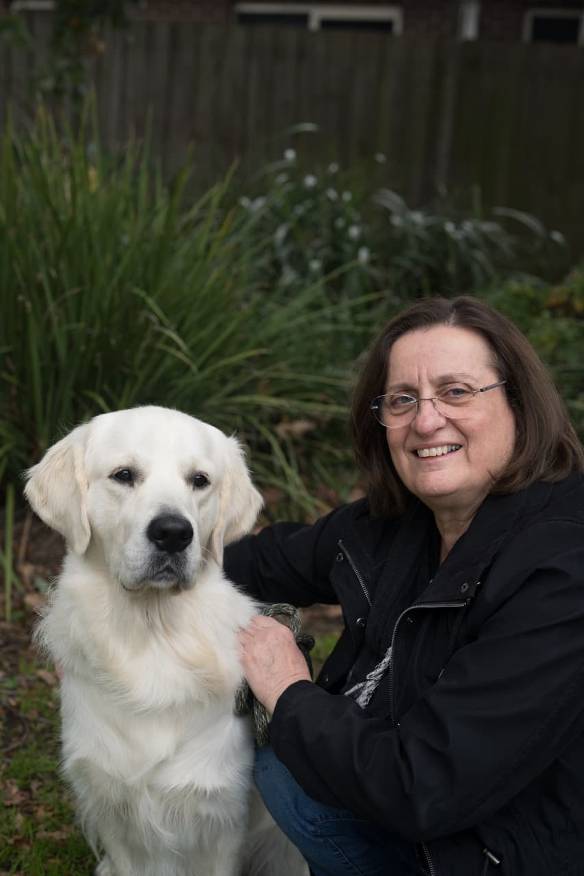 Dr Ana Hayes with a Golden Retriever